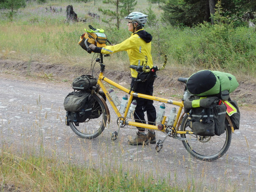 GDMBR: Terry is holding the Bee (a da Vinci Tandem) while Dennis watered the flowers.